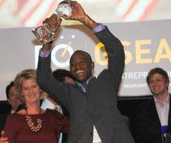 A jubilant Marishane accepts the award which confirms his status as one of the world's top young entrepreneurs.(Image: Global Student Entrepreneur Awards)  