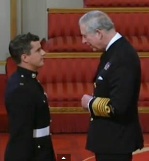 Southern African Craig Buchanan receives his medal from Prince Charles