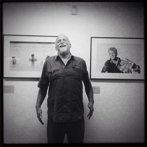 John Liebenberg poses next to his images of South Africa's Border War with Angola. (Image © Rise and Fall of Apartheid)