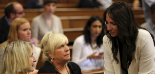 Oscar's sister Aimee is seen talking to Reeva Steenkamp's mother.