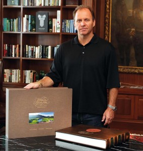 Grant Leversha with a leather-bound copy of 'Within an African Eden'