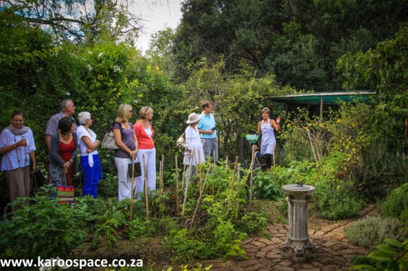 Kim van Niekerk takes visitors on a tour of her herb garden.