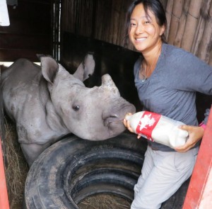 Kim Putman with baby rhino in South Africa