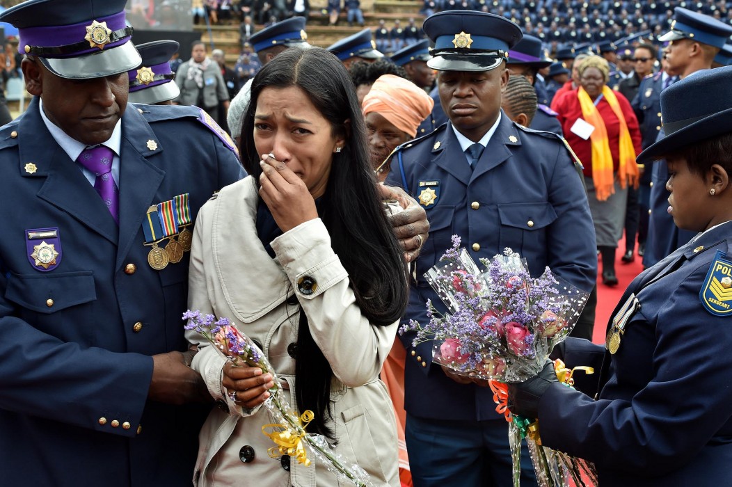 Family members of police who died on duty lay wreaths in remembrance of their loved ones during the South Africa Police Service Commemoration Day