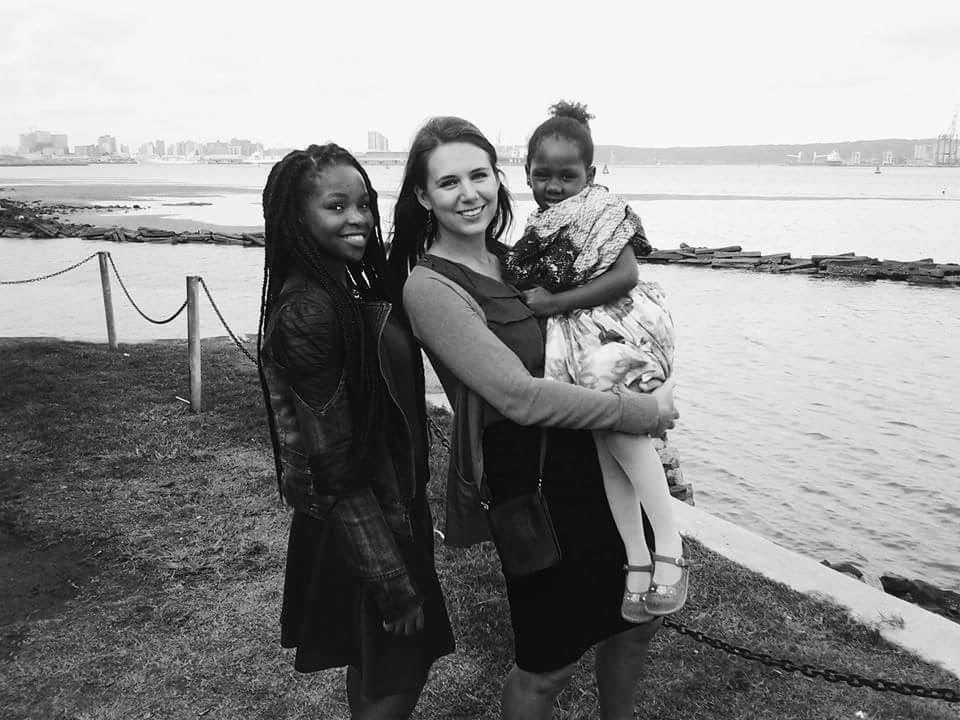 Lydia with her host family in Durban, at the harbour front.