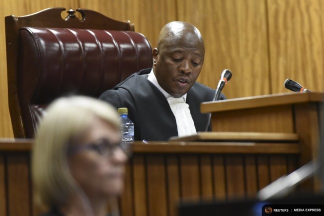 Jugde Aubrey Ledwaba listens in court during Oscar Pistorius' bail hearing at the North Gauteng High Court in Pretoria December 8, 2015. REUTERS/Herman Verwey/Pool