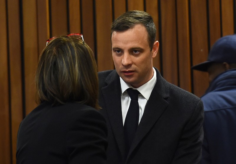 Olympic and Paralympic track star Oscar Pistorius speaks with his legal team ahead of his sentence hearing at the North Gauteng High Court in Pretoria, South Africa, July 6, 2016. REUTERS/Masi Losi/Pool