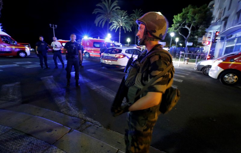 French soldiers cordon the area after at least 30 people were killed in Nice, France, when a truck ran into a crowd celebrating the Bastille Day national holiday July 14, 2016.  REUTERS/Eric Gaillard