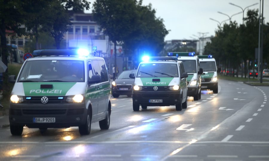 Police make their way to the scene of a shooting rampage at the Olympia shopping mall in Munich. REUTERS/Michael Dalder