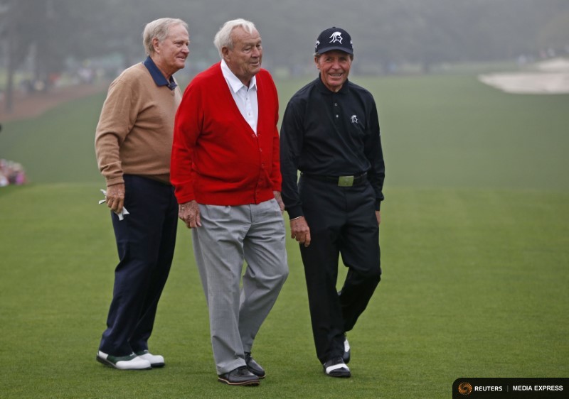 Former champions Jack Nicklaus of the U.S. (L), Arnold Palmer of the U.S. (C) and Gary Player of South Africa (R) stand on the first tee during the ceremonial start for the 2013 Masters golf tournament at the Augusta National Golf Club in Augusta, Georgia, U.S. on April 11, 2013. REUTERS/Mark Blinch/File Photo