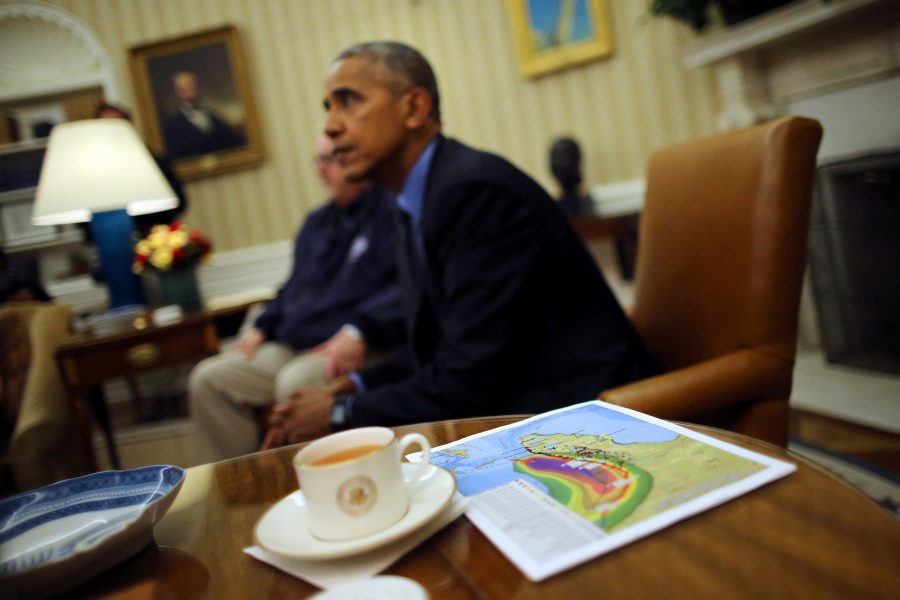 A map with the trajectory of Hurricane Matthew is seen as U.S. President Barack Obama talks to the media during a briefing with FEMA Administrator Craig Fugate (L), Secretary of Homeland Security Jeh Johnson (not pictured) and Deputy Homeland Security Advisor Amy Pope (not pictured) at the Oval Office of White House in Washington, U.S. October 7, 2016. REUTERS/Carlos Barria
