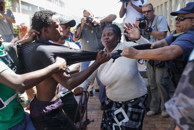 A protester and police officer scuffle on UCT's upper campus today.