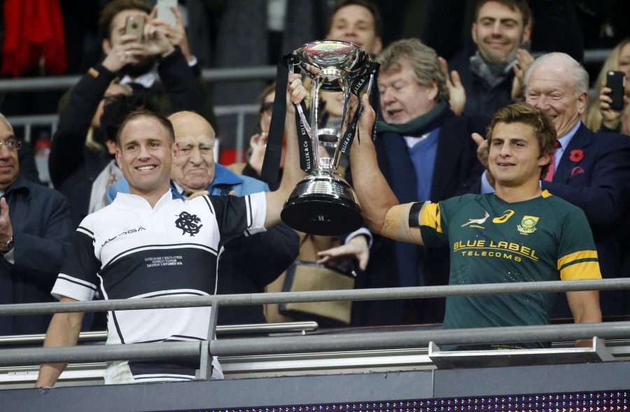 Britain Rugby Union - Barbarians v South Africa - The Killik Cup - Wembley Stadium - 5/11/16 Barbarians' Andy Ellis and South Africa's Pat Lambie share The Killik Cup at the end of the game Action Images via Reuters / Paul Childs Livepic EDITORIAL USE ONLY.
