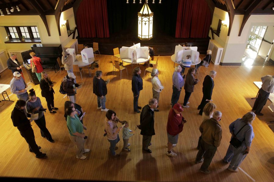 People wait to vote in the U.S. presidential election at Grace Episcopal Church in The Plains, Virginia, U.S., November 8, 2016. REUTERS/Joshua Roberts