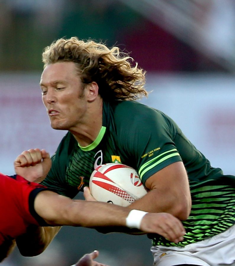 DUBAI, UNITED ARAB EMIRATES - DECEMBER 03: Werner Kok of South Africa in action against Wales during the Emirates Dubai Rugby Sevens - HSBC World Sevens Series Cup Semi Final match on December 3, 2016 in Dubai, United Arab Emirates. (Photo by Francois Nel/Getty Images)