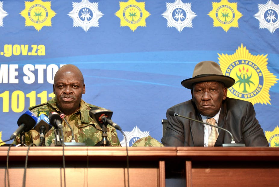 South Africa’s police commissioner, Khehla Sitole, and police minister, Bheki Cele