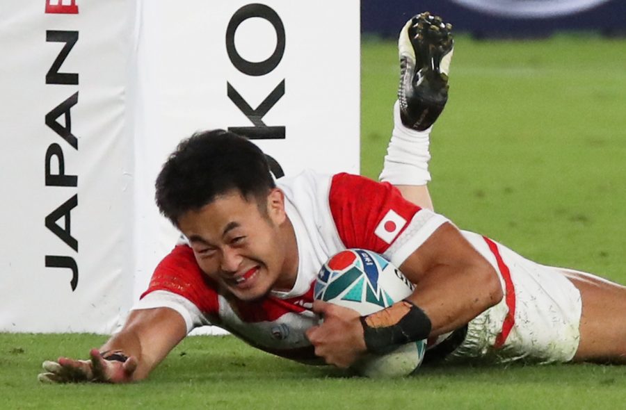 Japan's Kenki Fukuoka scores their fourth try REUTERS/Kevin Coombs