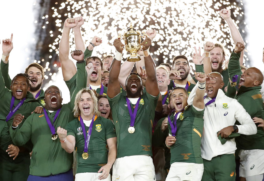South Africa's Siya Kolisi celebrates with the Webb Ellis trophy after winning the World Cup Final.