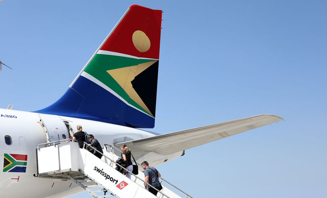 assengers board a South African Airways plane at the Port Elizabeth International Airport in the Eastern Cape province