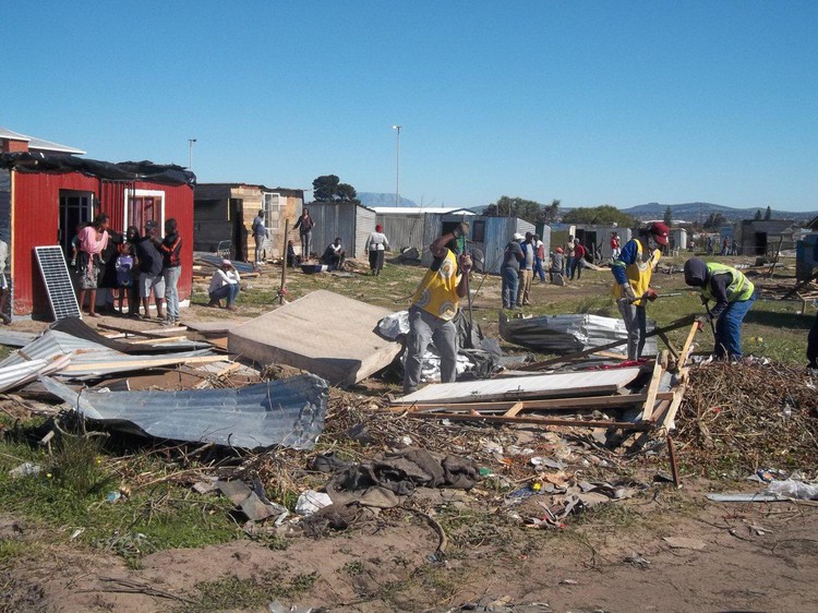 Anti-land invasion unit members demolishing shacks in Bloekombos on Friday. Photo: Vincent Lali