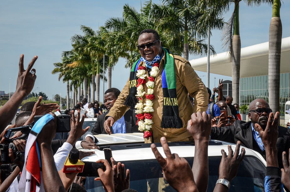 Tundu Lissu reacts to supporters as he returns home after three years in exile.
