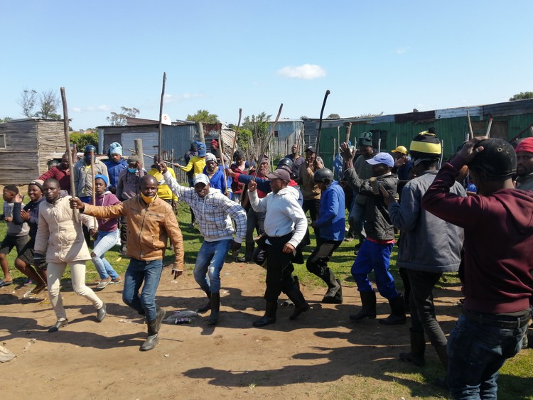 Some of the former employees of Dippin Blu Racing in Fairview, Port Elizabeth who stormed the stables in protest on Thursday, killing one horse and injuring over 20 others. Photo: Mkhuseli Sizani