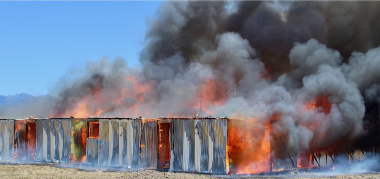 An experiment by the Fire Engineering Research Unit at Stellenbosch University showed how 20 homes in an experimental informal settlement caught fire in five minutes. Photo: Stellenbosch University.