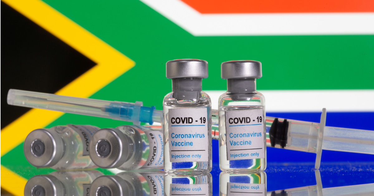 Vials labelled "COVID-19 Coronavirus Vaccine" and sryinge are seen in front of displayed South Africa flag in this illustration taken, February 9, 2021. REUTERS/Dado Ruvic/Illustration/File Photo