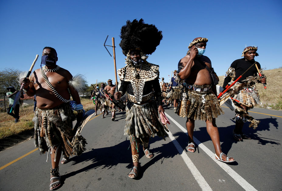 Supporters of former South African President Jacob Zuma walk to his home in Nkandla