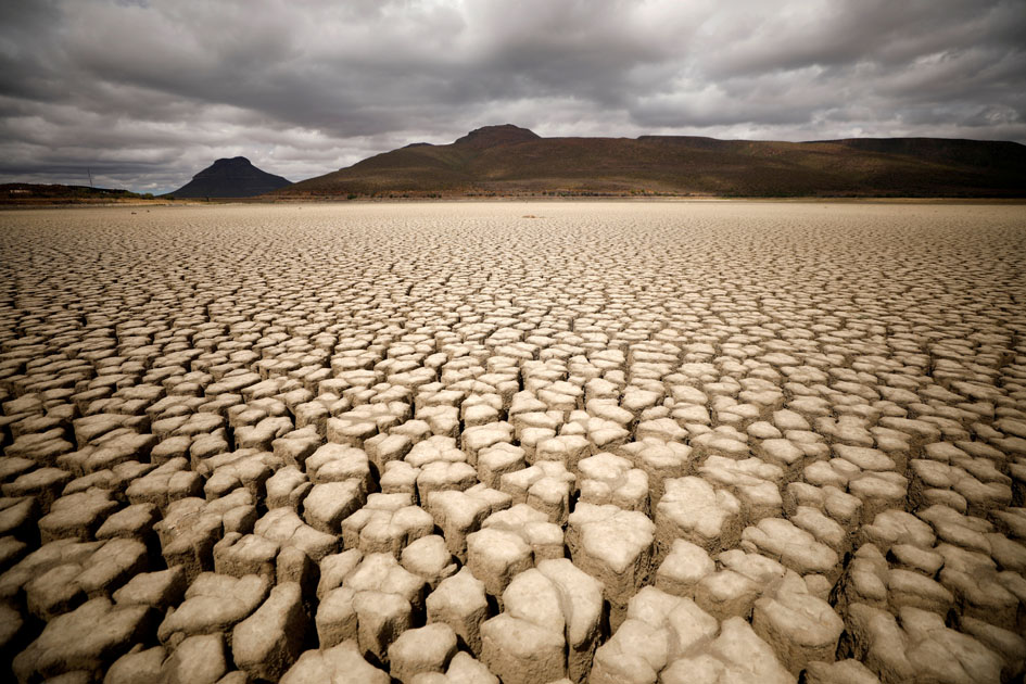 Clouds gather but produce no rain as cracks are seen in the dried up municipal dam in drought-stricken Graaff-Reinet, South Africa, November 14, 2019.