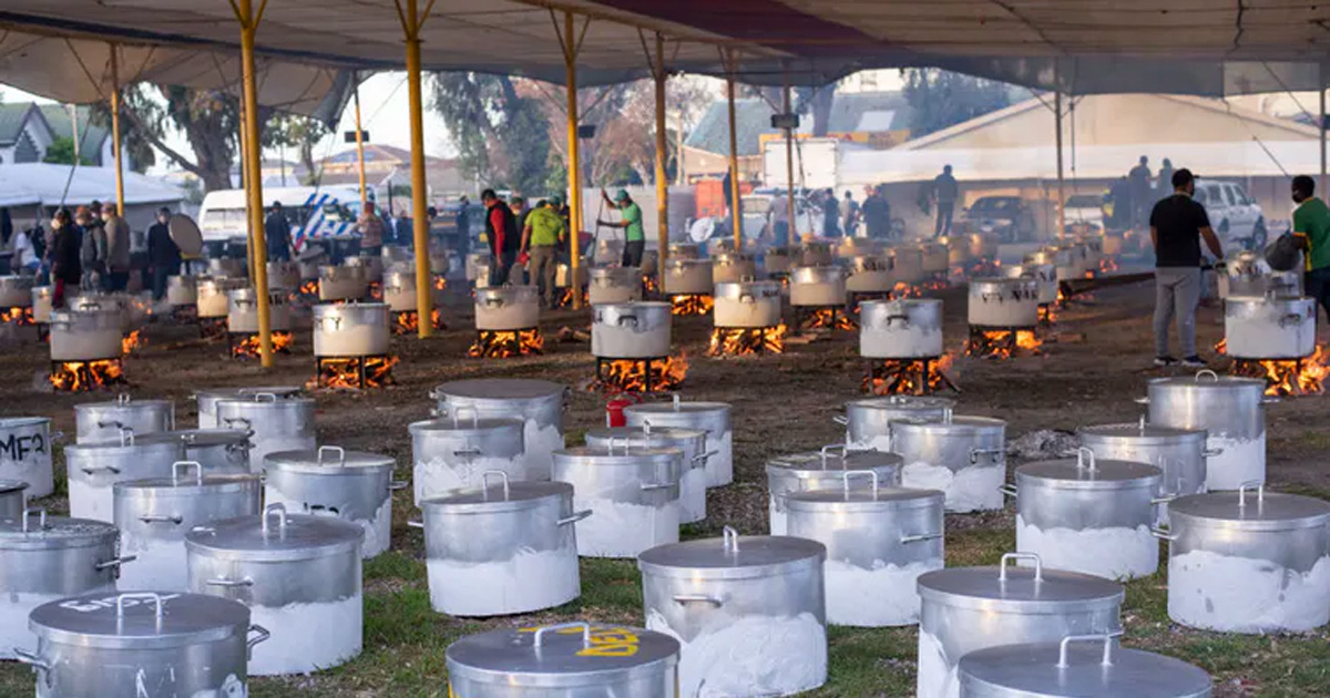 Food is prepared by a South African non-profit to feed over 87 000 people in underprivileged communities at the height of the COVID-19 pandemic in Cape Town in 2020. Photo by Brenton Geach/Gallo Images via Getty Images