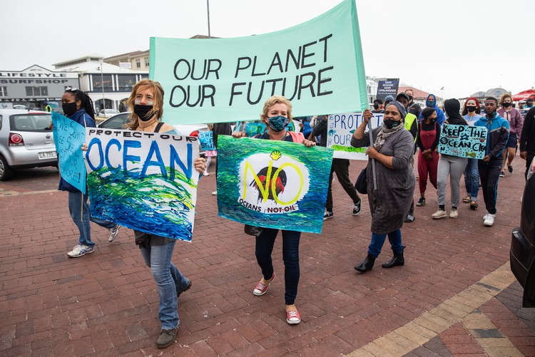 Protesters in Muizenberg, Cape Town call for Shell’s seismic survey on the Wild Coast to be stopped. Photo: Ashraf Hendricks