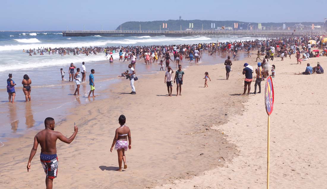 Revellers enjoy New Year's Day on a beach, in Durban