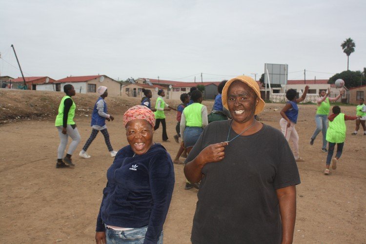 Ntomboxolo Twalingca (left) and Mandisa Ncamiso (right) spent a month cleaning piles of rubbish from this field in KwaNobuhle township in Kariega so they could start a netball club for teenage girls from the community. Photo: Thamsanqa Mbovane