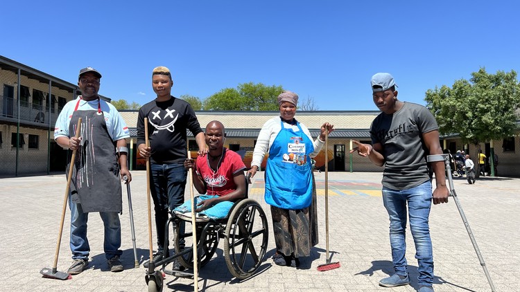From left to right: John Beto, Sinoxolo Tofi, Baithuti Sasha, Else Beto and Thobani Ngenjani are among a group of disabled residents in Dunoon who are taking up the task to be cleaners at a local school for six months. Photo: Peter Luhanga