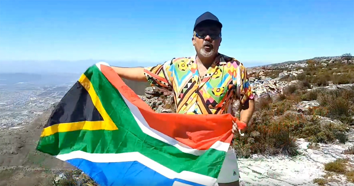 Faried Swartz on Table Mountain singing What the world (and South Africa) needs now