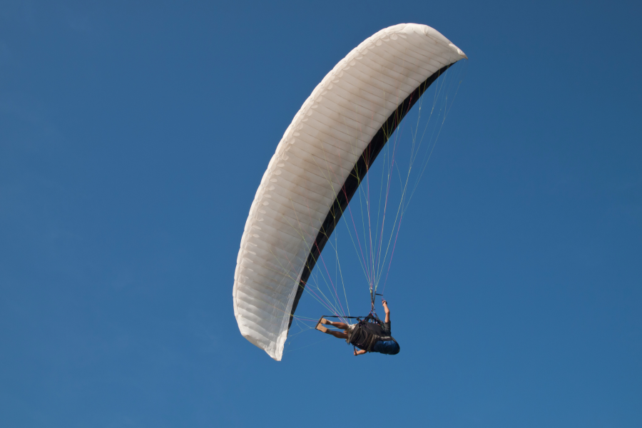 flying above the clouds paraglider