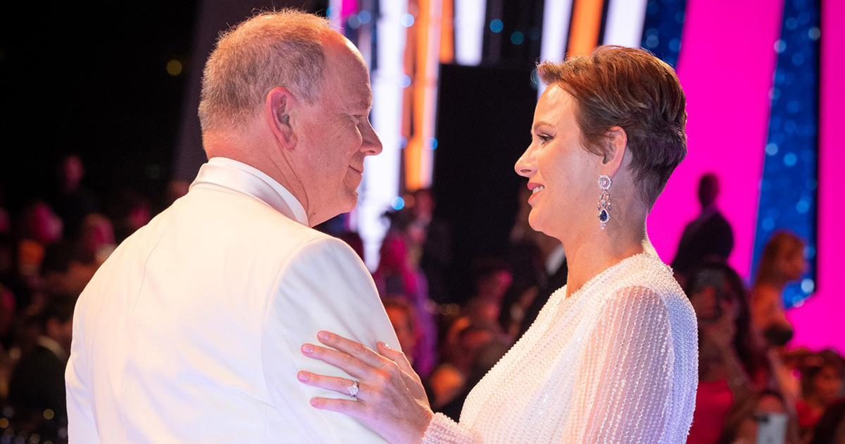 Princess Charlene dances with her Prince as Robbie Williams performs at Monaco Red Cross event