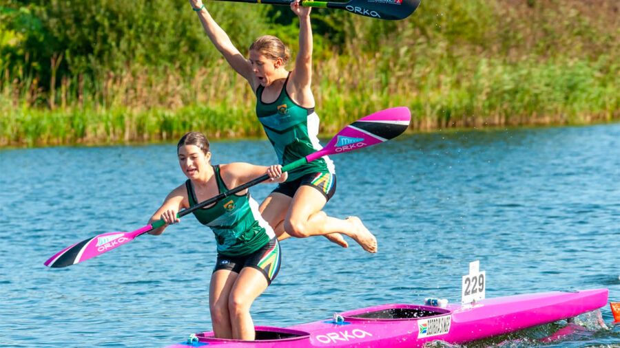Holly Smith and Gergia Singe celebrate after winning the Junior K2 race at the ICF Canoe Marathon World Championships in Denmark on Friday.