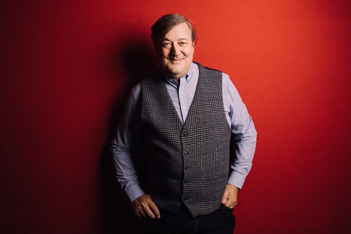 Stephen Fry portrait against red background