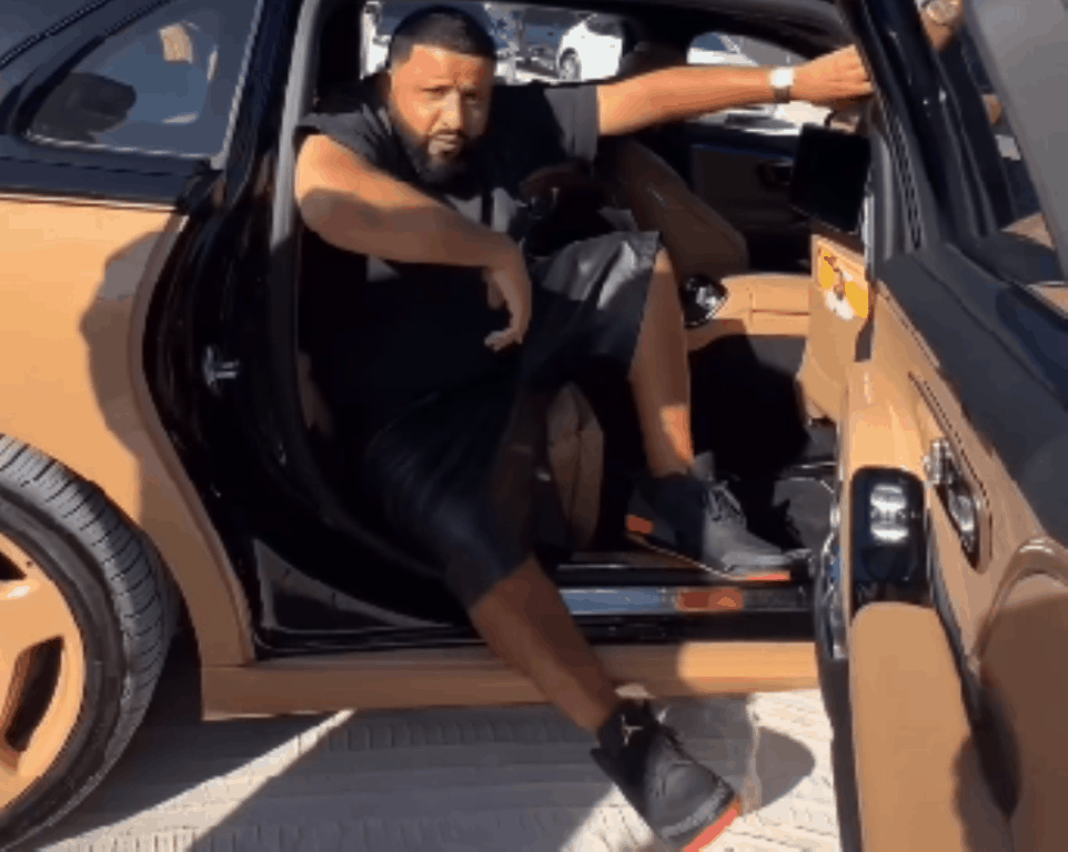 DJ Khaled carried by security to avoid getting his sneakers dirty