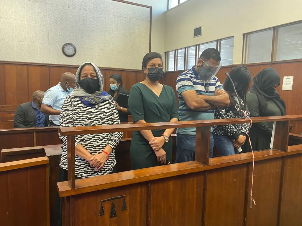 Thoshan Panday in court with his mom and wife.