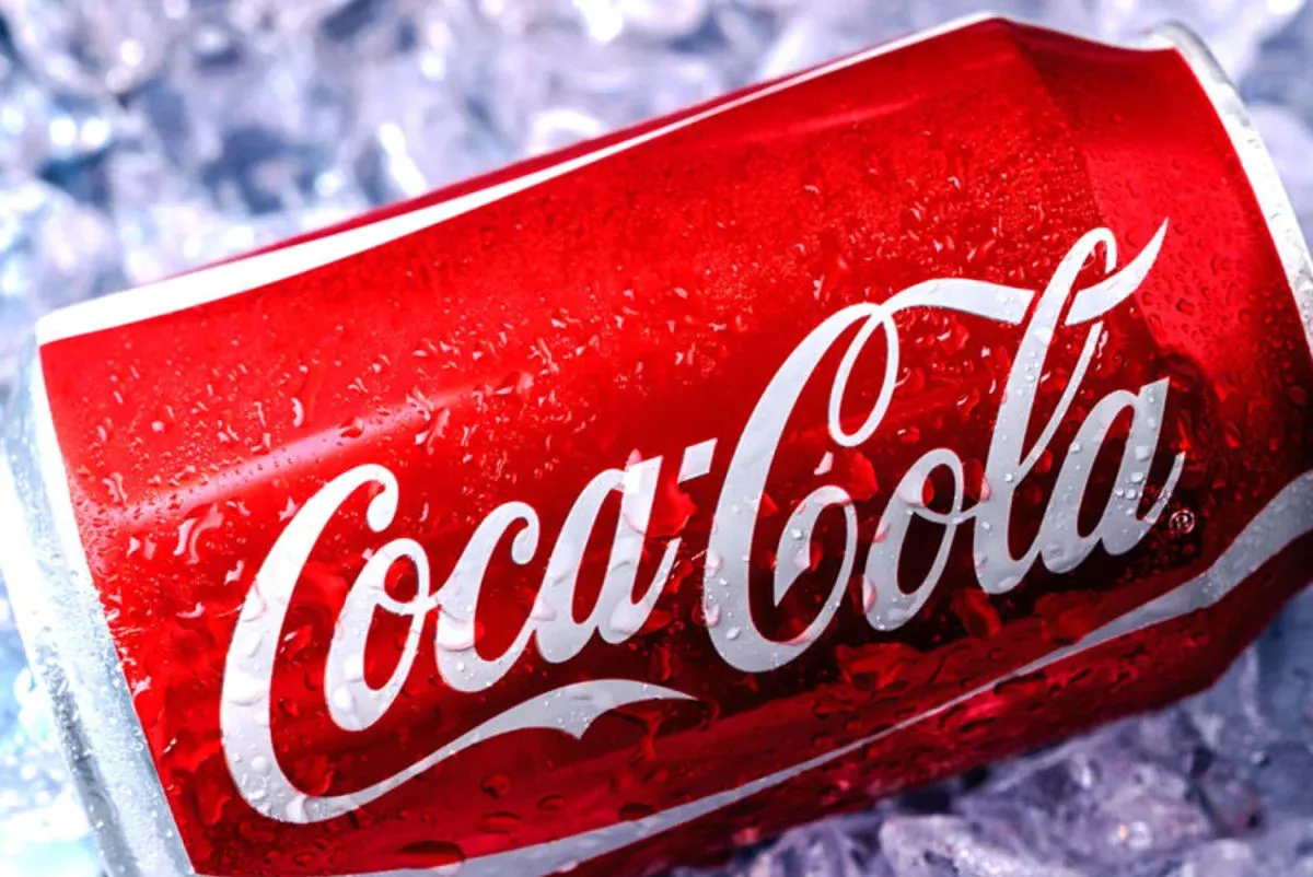 Beverage giant Coca-Cola has agreed to use real cane sugar in its US production, President Donald Trump announced.