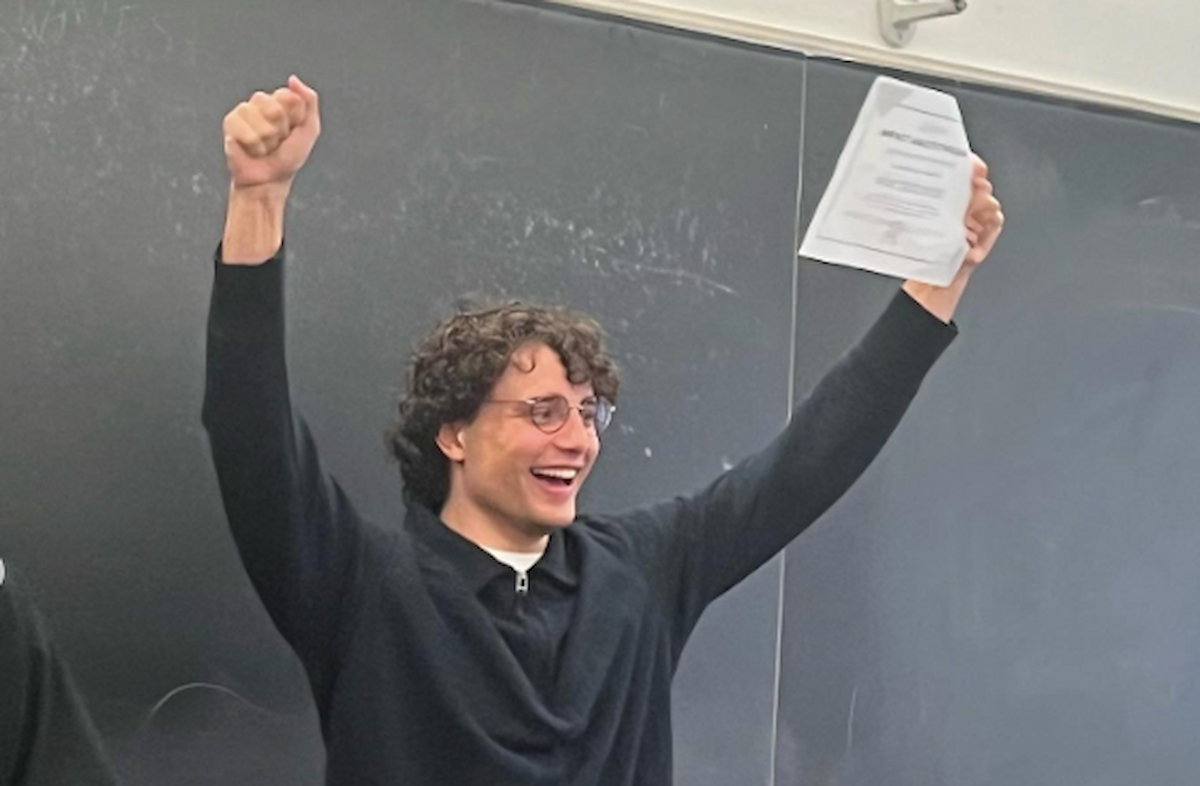 image of sam terblanche celebrating in class at university