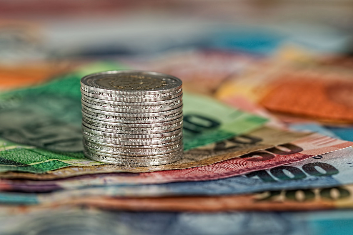 Stock image of South African currency depicting South African companies hoarding money