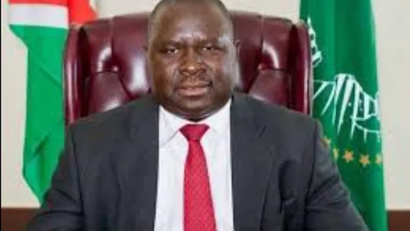 Adolf Hitler Uunona sitting in chair behind a desk. This image accompanies a story about this oddly named man, who is running for re-election in Namibia