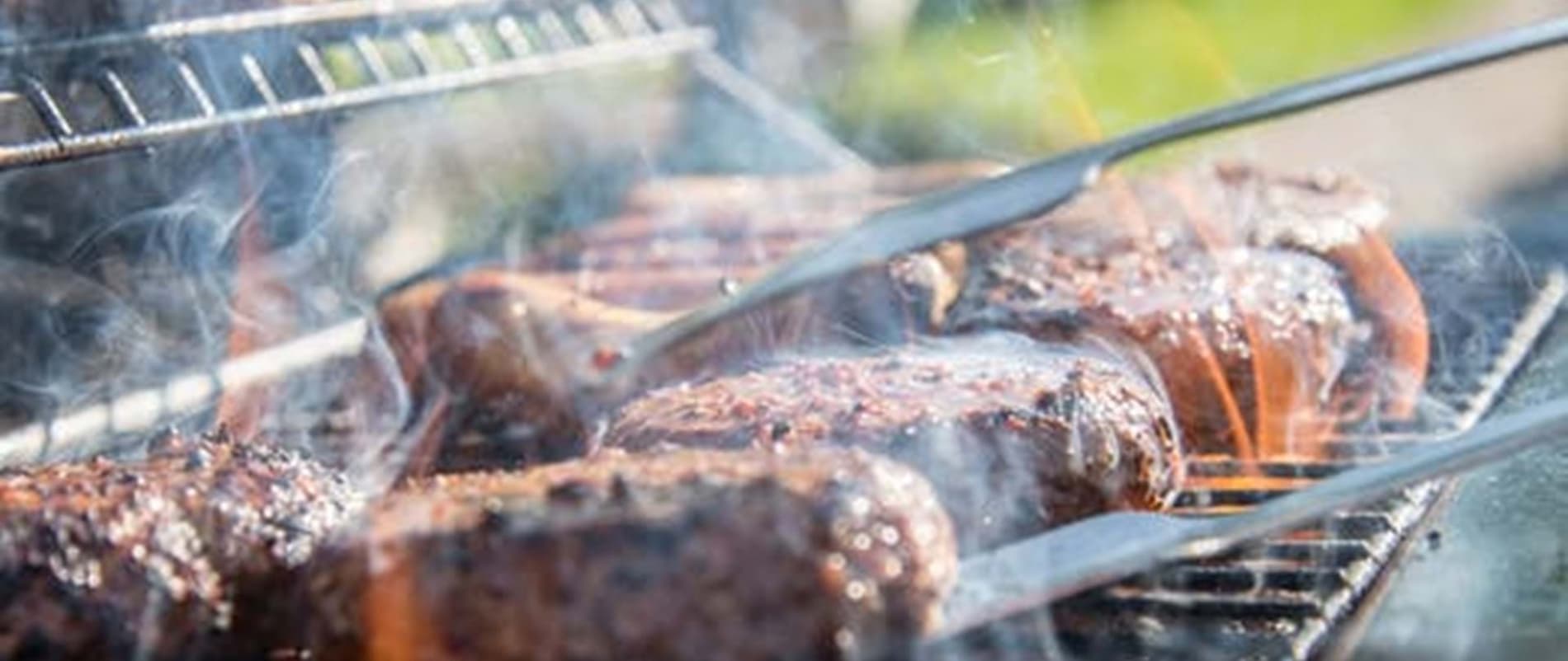 Image of meat braaing on a grill, to accompany an article about South Africa's meat prices and the October 2025 CPI