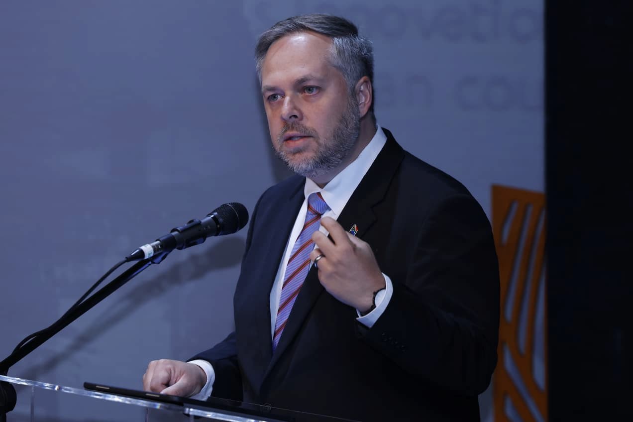 Minister of Home Affairs, Leon Schreiber speaking in front of podium. This image accompanies a story about Home Affairs denying allegations that US officials were arrested in a Johannesburg raid