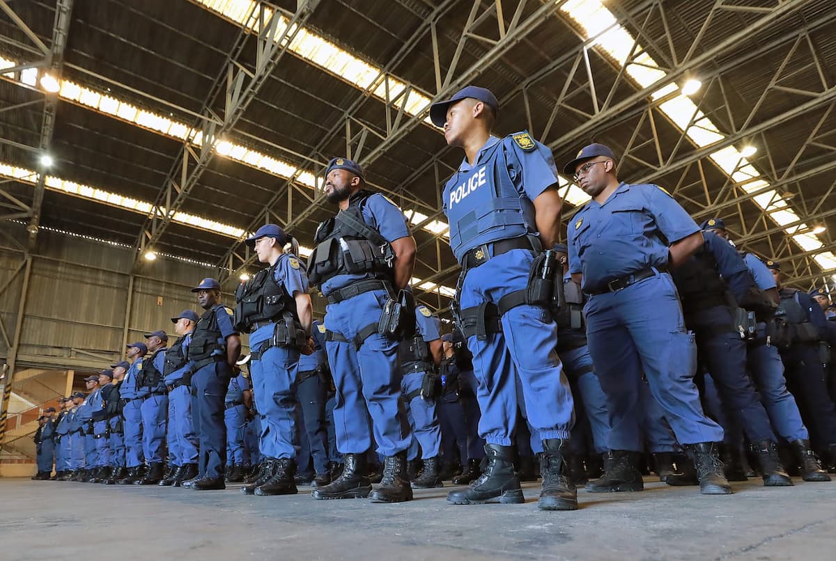 Image of South Africa Police Service (SAPS) officers standing at attention. This image accompanies an article about crime stats for first and second quarter 2025-2026