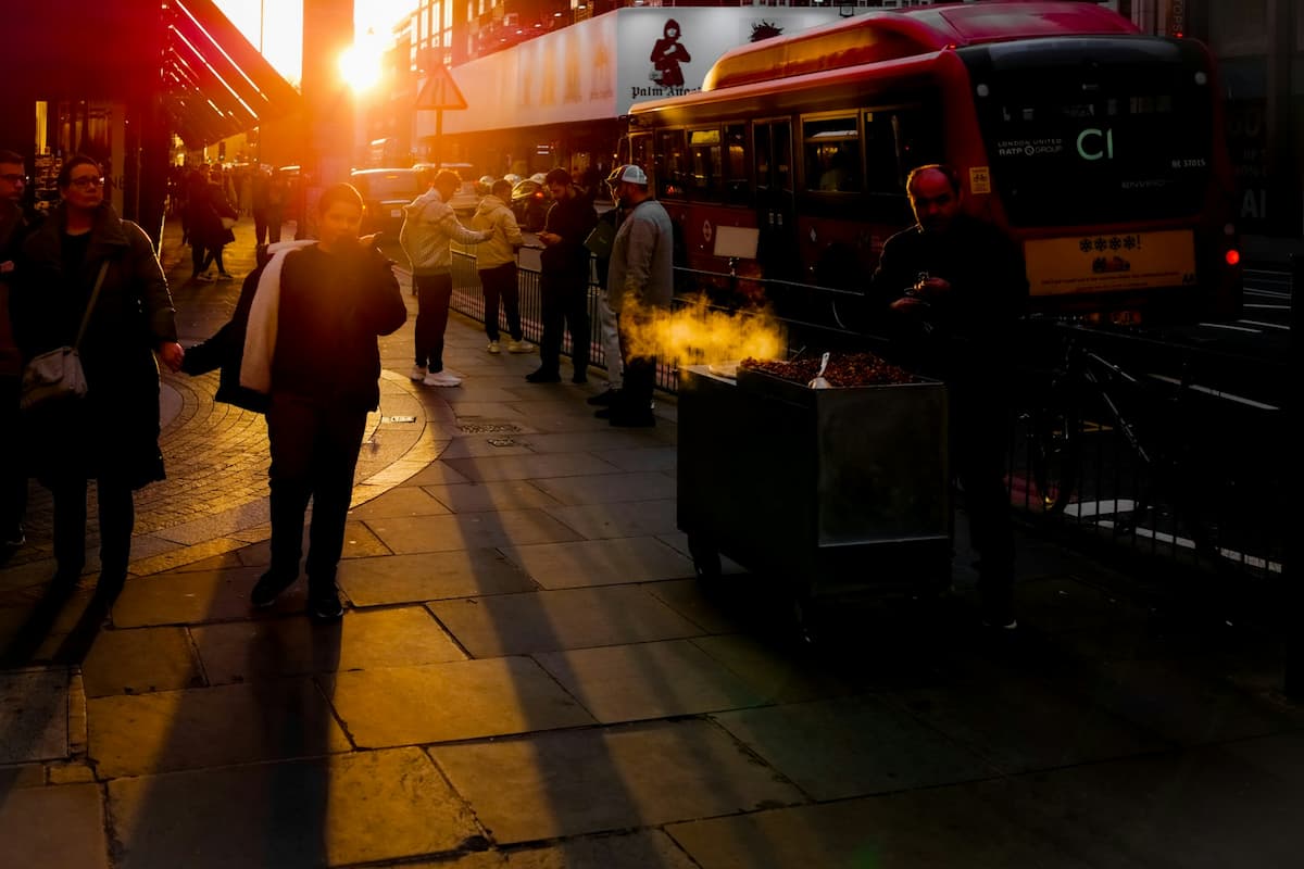 Image of bustling street in London, accompanying an article is about the shortest day of the year and expats struggling with earlier sunsets and